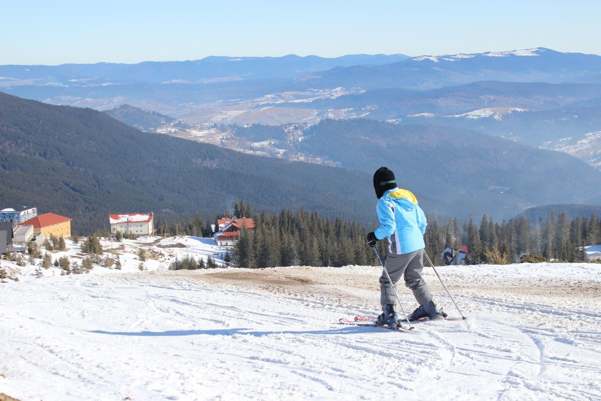 Skier crossing a snowy mountain slope