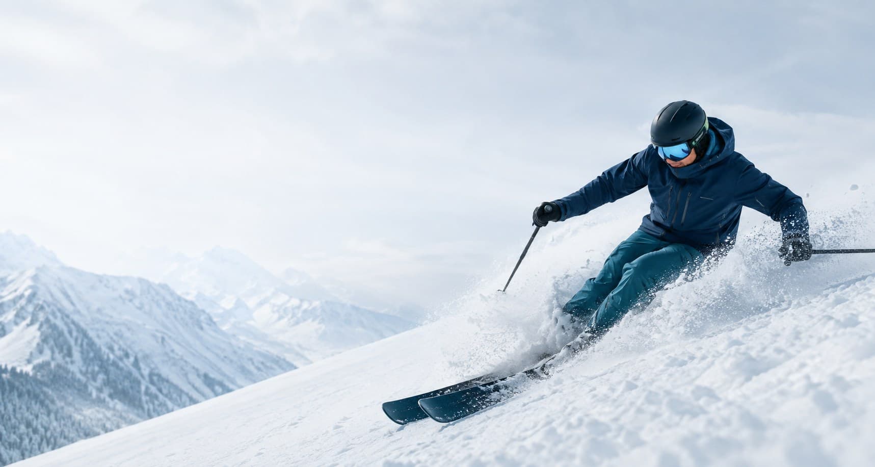 A skier carving a turn through deep alpine powder